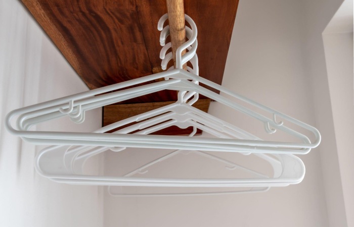 Install a Tension Rod to Create More Hanging Space.